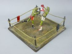 A COLD BRONZE BERGMAN GROUP of two boxing frogs in a 'boxing ring'