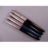 Four Vintage Parker 51 fountain pens (three black, one teal)