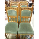 AN EXCELLENT SET OF SIX EDWARDIAN BLONDE OAK DINING CHAIRS, high backed with carved detail,