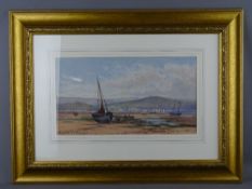 PETER GHENT watercolour - beached boats with town and mountains to the background, signed, 21.5 x 39