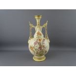 A ROYAL WORCESTER 1071 PATTERN TWIN RETICULATED HANDLED VASE having floral sprays in gilt relief,
