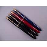Four Vintage Parker Slimfold fountain pens (two black, one blue, one red), all with 14k nibs
