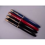 Four Vintage Parker Slimfold fountain pens (two black, one blue, one red), all with 14k nibs