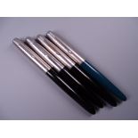 Four Vintage Parker 51 fountain pens (three black, one green)