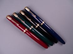 Four Vintage Parker Duofold fountain pens (black, blue, green, red) including one Maxima, all with