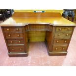 A VICTORIAN MAHOGANY INVERTED BREAKFRONT KNEEHOLE DESK, 87 cms high (top of back rail), 136 cms