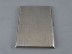 A RECTANGULAR SILVER CIGARETTE CASE with engine turned decoration, Birmingham 1931, 5 troy ozs,
