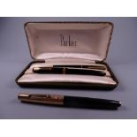 Vintage black Parker 61 fountain pen with engine-turned RG cap (jewel missing on cap) and a