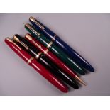 Four Vintage Parker Duofold fountain pens (black, blue, green red), all with 14k nibs and one red