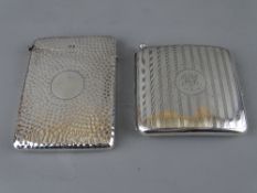 A SILVER CIGARETTE CASE with integral striker and a silver calling card case (hinge damaged) with
