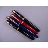 Four Vintage Parker Duofold fountain pens (two black, one blue, one red) all with 14k nibs