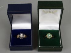 TWO NINE CARAT GOLD DRESS RINGS including a wide textured band example, flower set with sapphires