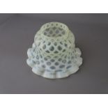 A VASELINE GLASS LAMPSHADE with frilly edge, 15.5 cms diameter maximum