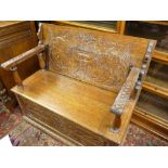 A GOOD CARVED OAK BOX SEAT MONK'S BENCH, 79 cms high closed, 105 cms wide, 47.5 cms deep