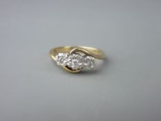 A NINE CARAT GOLD THREE STONE DIAMOND IN ILLUSION SETTING RING, size 'P', 4 grms gross