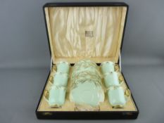 A CASED SET OF SIX SHELLEY BONE CHINA COFFEE CUPS & SAUCERS, mint colour with gilt highlighting, '