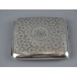 A FLORAL CHASED SILVER CIGARETTE CASE, Sheffield 1916, 3 troy ozs (monogrammed)
