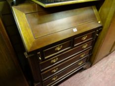 Neat reproduction mahogany bureau with three long and two short base drawers