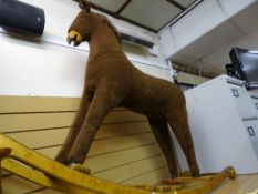 Large brown upholstered rocking horse