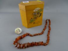Set of possibly amber beads, decorative ring and an Oriental box