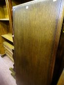 Reproduction mahogany cupboard with narrow top drawer and an oblong polished refectory style