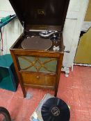 Well maintained HMV winding gramophone in a polished cabinet (side panels to cabinet requiring