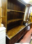 Good polished dresser with two linenfold cupboard doors and two drawers on barley twist supports
