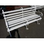 White painted wooden slatted scrolled metal garden bench