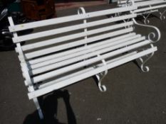 White painted wooden slatted scrolled metal garden bench