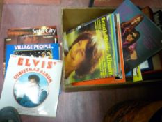 Box of assorted LPs including Elvis, Abba, The Village People, Shirley Bassey etc