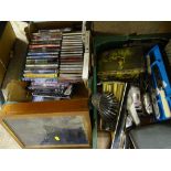 Box of DVDs and a box of miscellaneous items including vintage tins, rulers, cutlery etc