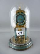 Vintage anniversary clock under a glass dome