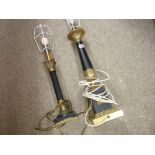 Two classically styled gilt and black decorative table lamps