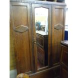 Polished double wardrobe with centre mirror door and base drawer