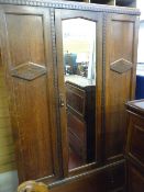 Polished double wardrobe with centre mirror door and base drawer
