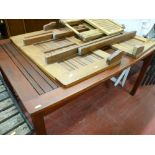 Teak extending garden table along with one other folding table