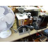 Cubika Gaggia coffee machine, one other and a white electric desktop fan E/T