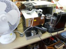 Cubika Gaggia coffee machine, one other and a white electric desktop fan E/T