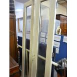 Pair of white framed and glazed doors