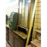 Railback sideboard with two drawers over two doors and a china cabinet