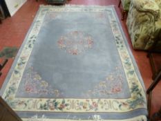 Washed Chinese rug with tasselled ends