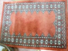 G H Frith burgundy coloured rug