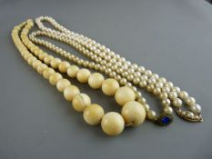 Ivory graduated bead necklace, a freshwater pearl necklace with oval nine carat gold clasp having