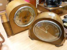 Two polished mantel clocks