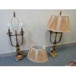 Pair of large metallic ornate lamps and shades