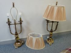 Pair of large metallic ornate lamps and shades