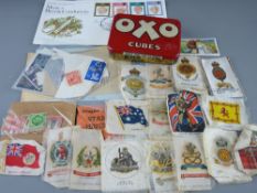 Small collection of unsorted stamps, a quantity of cigarette silks and a vintage OXO cube tin