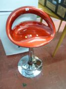 Red seated chrome based bar stool
