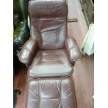 Burgundy leather effect swivel easy chair and matching footstool