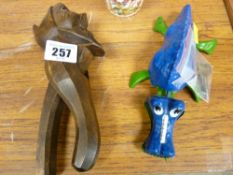 Carved wood, possibly Black Forest nutcracker and a Triang mini Jabberwock clockwork toy